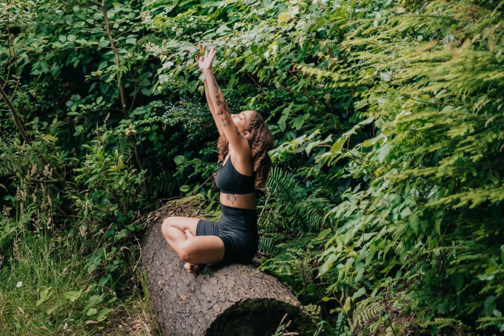 woman meditating in jungle